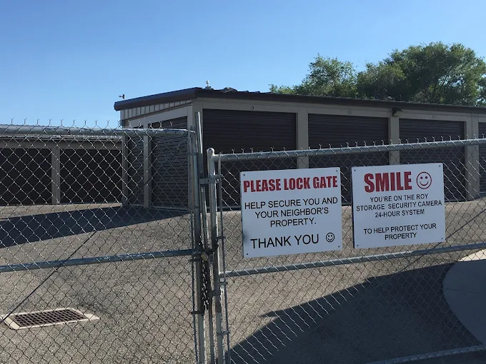Combination-controlled gate with security signage